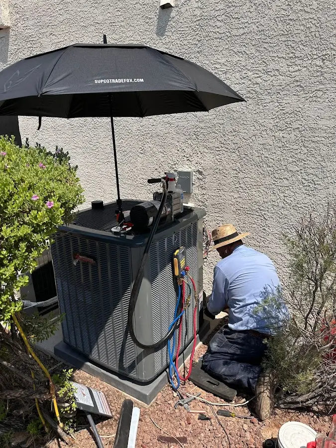 HVAC technician performing outdoor AC maintenance in Sunnyvale